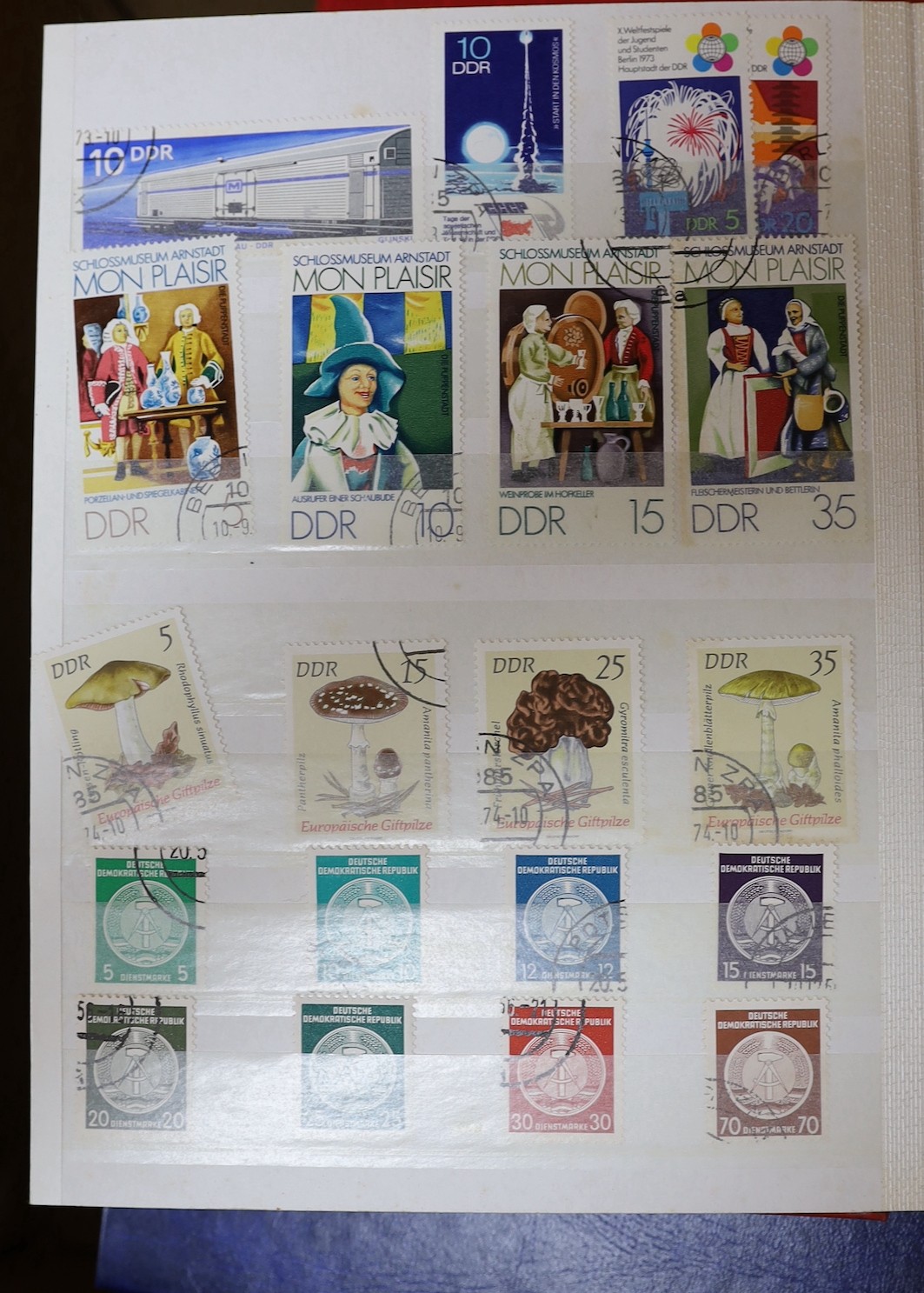 Four stock books of British stamps, QEII mint unused definitives and stamp books, some pre-decimal and two stock books of DDR used and mint unused stamps